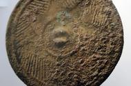 揭秘：中国史前遗址出土最古老带纹青铜镜的神秘面纱